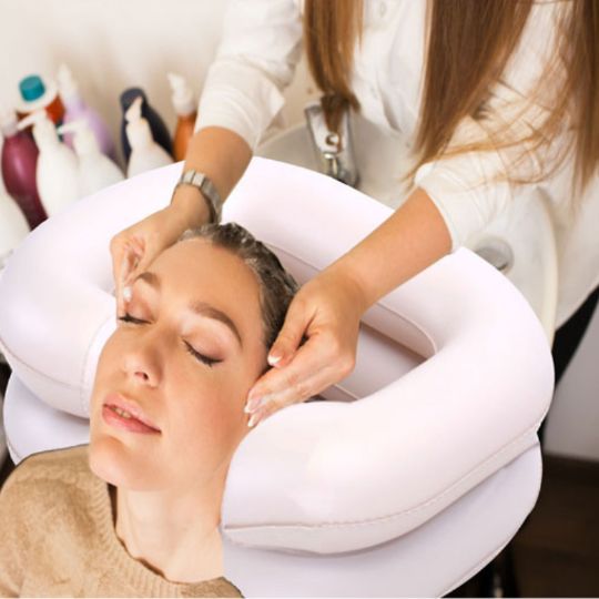 Hair wash using an inflatable hair wash basin for comfort and support