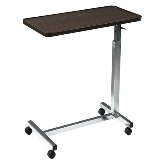 This is a height-adjustable overbed table with a walnut wood-grain laminate top and a silver frame.