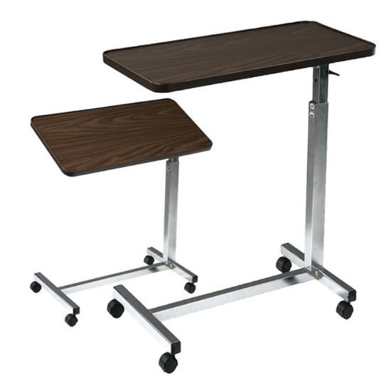 Pair of height-adjustable overbed tables with walnut wood-grain laminate tops and silver frames.