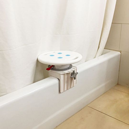 The rotating bathtub seat securely attaches to the tub, offering easy adjustability for added comfort and convenience.