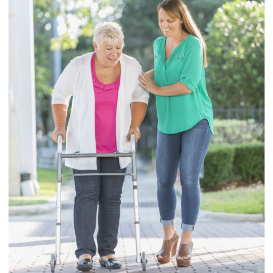 Folding walker while being assisted with other