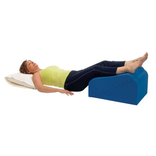 Elevating legs with the personal wedge pillow for enhanced comfort and support