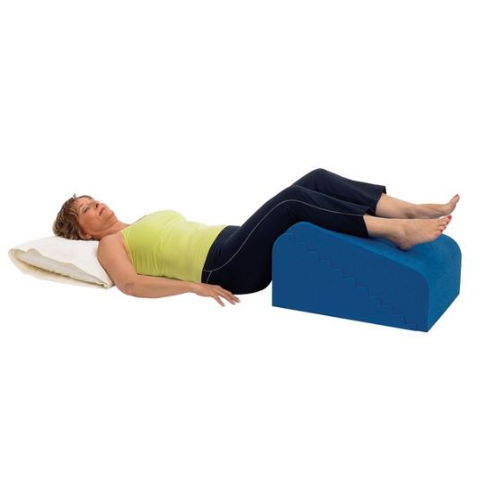 Relaxing with legs elevated on the supportive personal wedge pillow