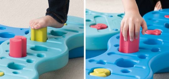 Hands and feet in action with the Reef Rescue activity, building motor skills through interactive play