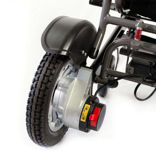This wheelchair features locking wheels, and rear wheel drive