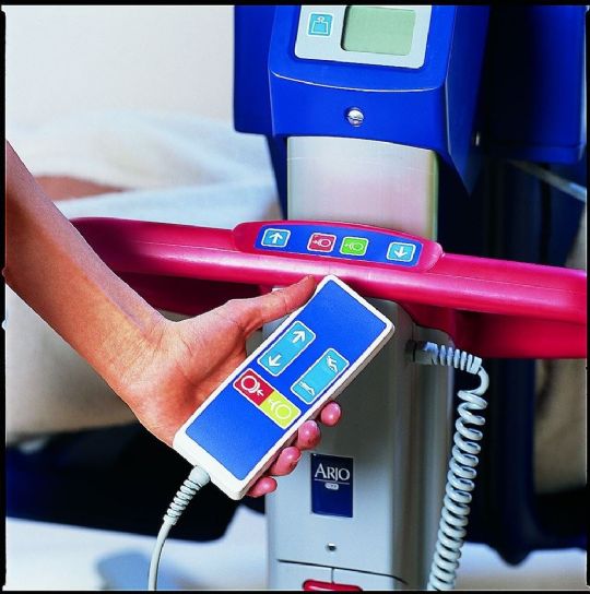 Handheld remote for functional control at caregiver fingertips while close to patients at all times