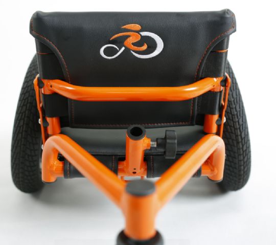 The stabilizing, rear third wheel of the Low Rider Special Needs Tricycle Activity Chair