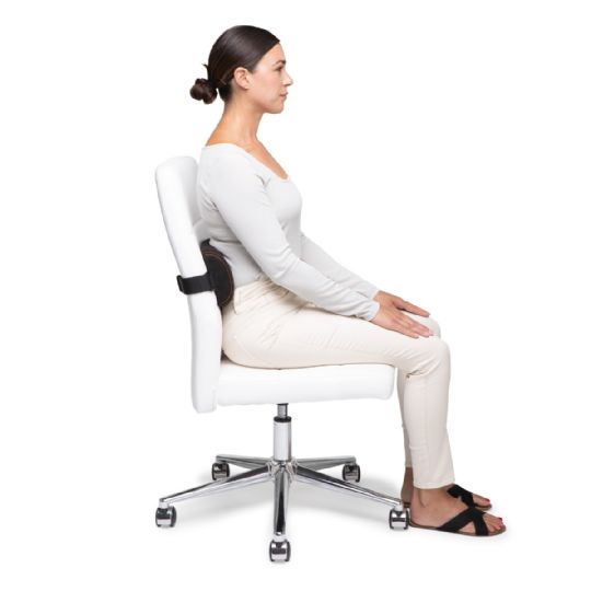 Demonstrating proper posture with the original mckenzie signature slimline on an office chair