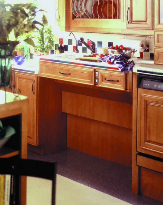 Raised to its maximum, it matches the counter height of standard base cabinets.