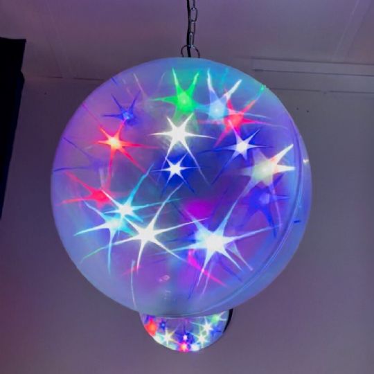 The sparkling stars and slow orbital motion within the sphere can provide visually engaging and calming sensory stimulation