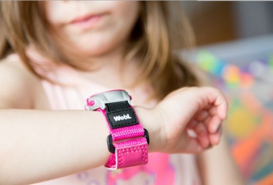 Pink WobL watch shown in use