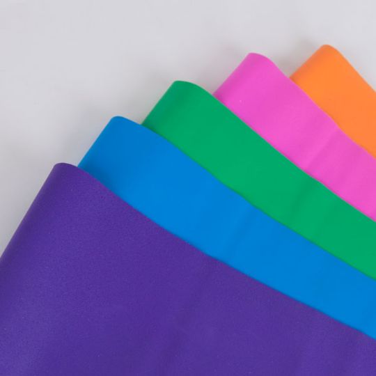 Color coded resistance bands, from orange to purple, allow for a beginner to advanced progressive exercise. 