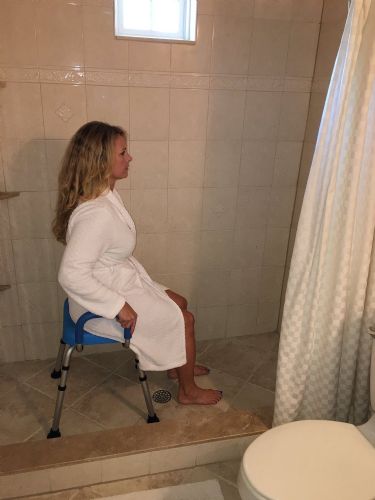 Independence Padded Shower Stool with Armrests by Platinum Health in use