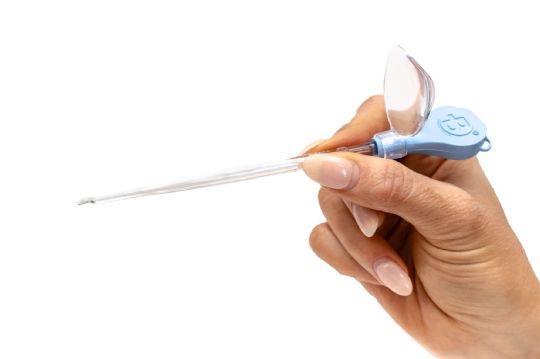 Close-up view of held curette