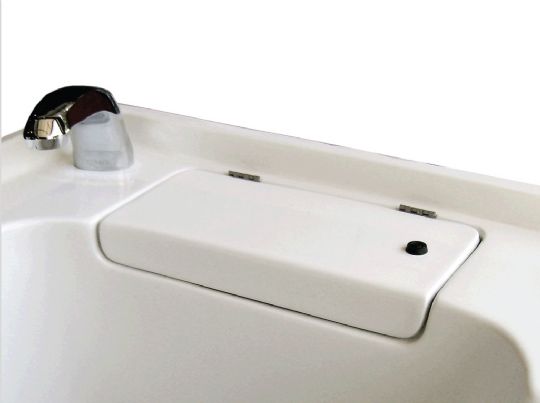 The locked cabinet of the built-in  disinfectant system located on the top of the bathtub. 
