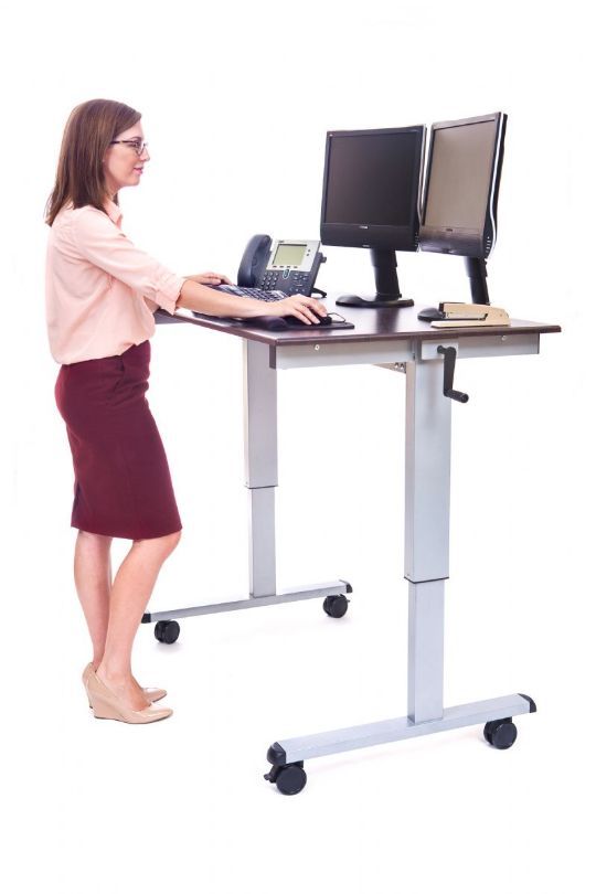 Crank Adjustable Stand Up Desk fits two monitors on its desktop.